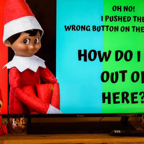 An elf stuck in the TV with a message saying help I can't get him out!