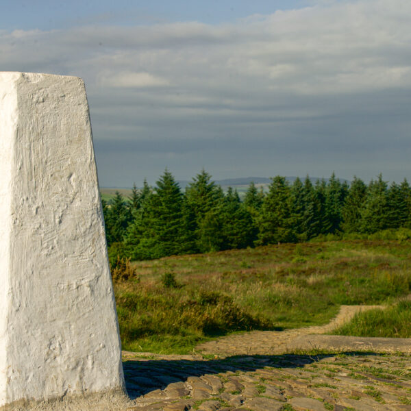 The white post at the top of Beacon Fell which signifies the highest point.