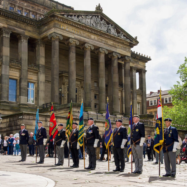 A group of men stood on the flag Market in Preston at The Armed Forces Day.