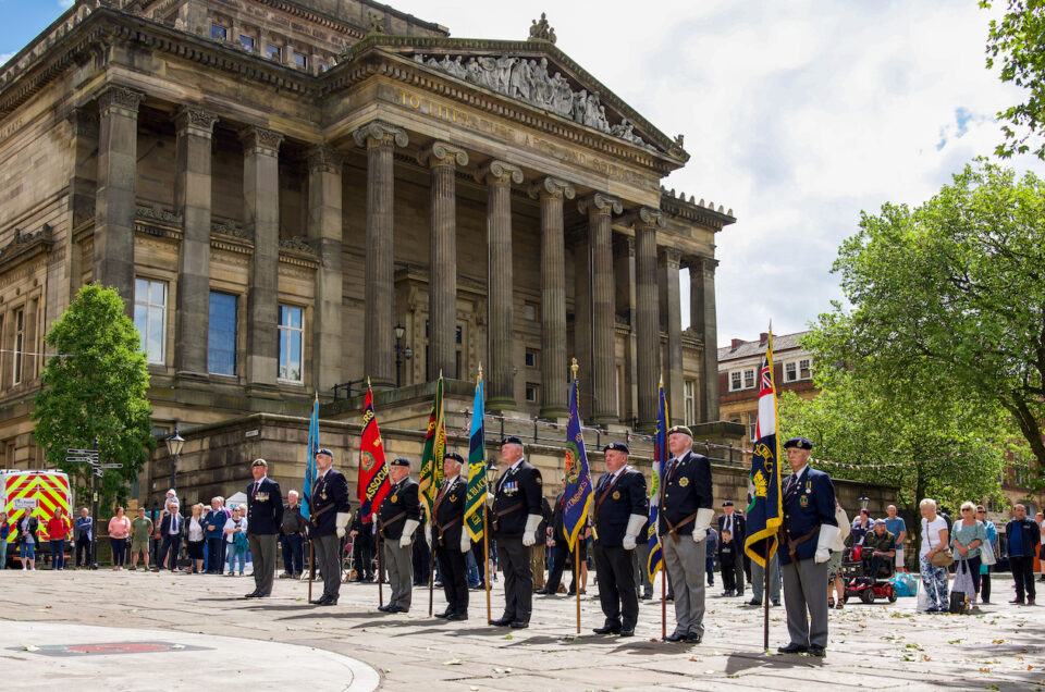 A group of men stood on the flag Market in Preston at The Armed Forces Day.