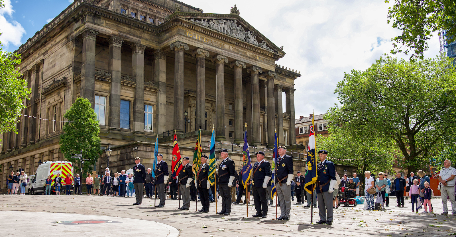 A group of men stood on the flag Market in Preston at The Armed Forces Day.