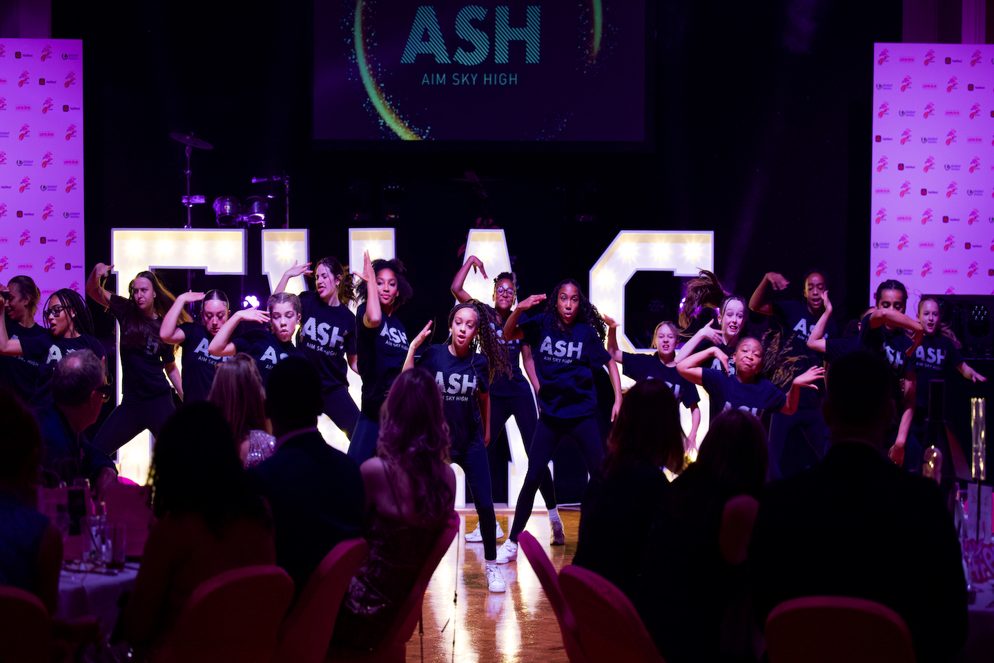 A dance group at EVAS 2024 named Sky, dancing in front of an audience.